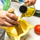 aioli being made with mortar and pestle